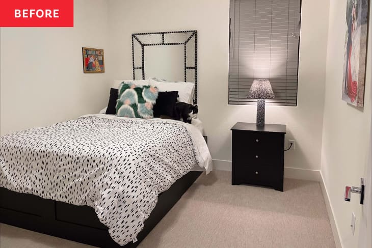 "before" photo of guest bedroom before being redone. The room is mostly white and quite bare, with a few black accents on the bedding, etc