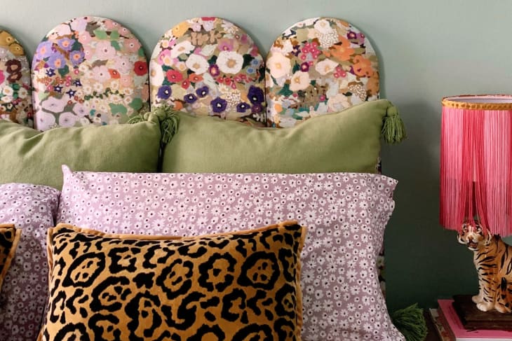 close-up image of a floral upholstered headboard