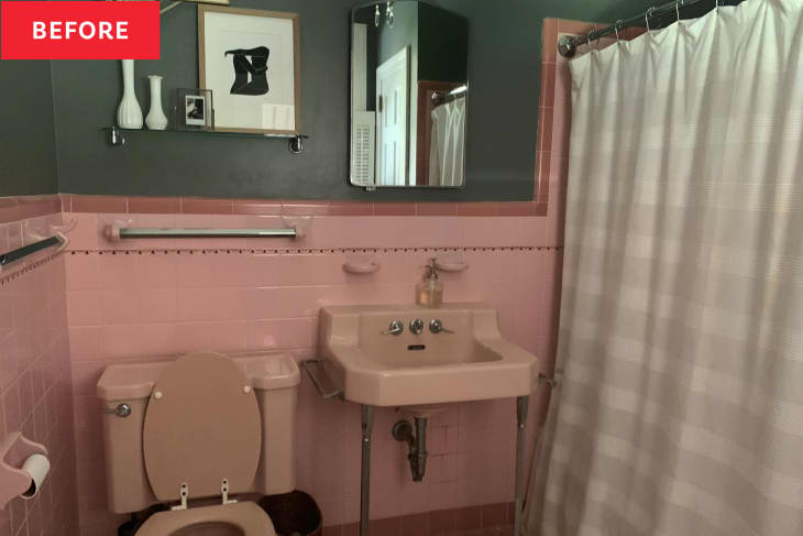 Vintage pink tiled bathroom with green painted walls before renovation.