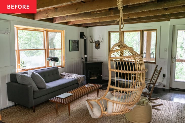 Before: White-walled cabin libing room with rattan swinging chair