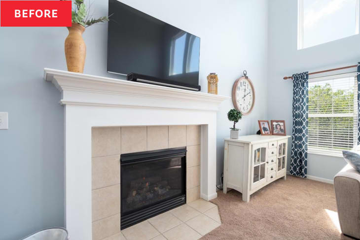 Fireplace with television before renovation.