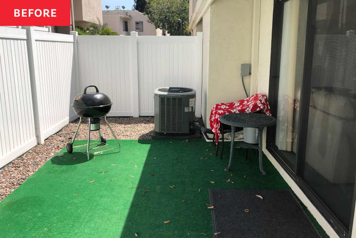 Patio area with green astro turf before renovation.