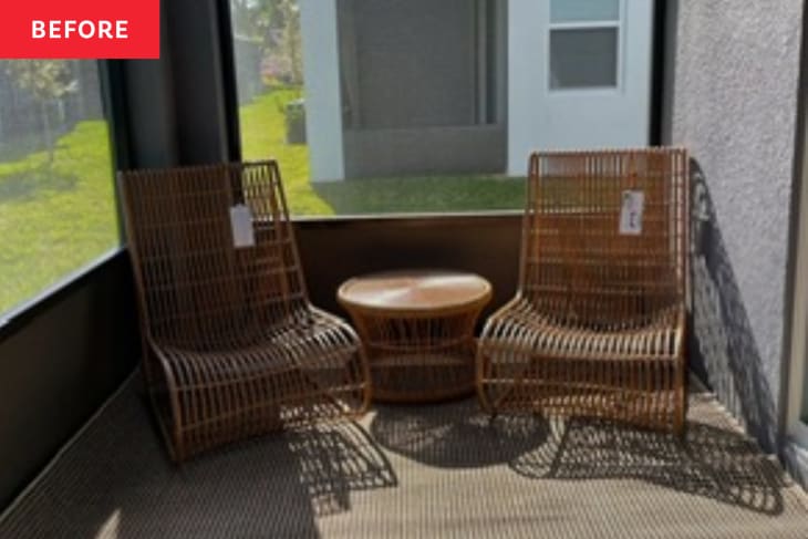 Patio before renovation: large natural fiber rug, 2 cane chairs, and small table