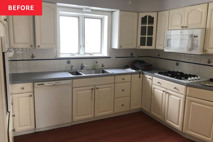 White kitchen with neutral color cabinets before renovation.