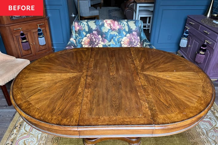 Oval wood dining table before makeover.