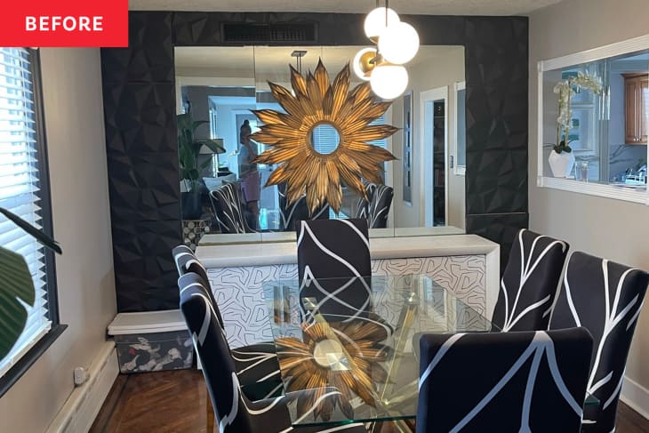 Dining room with glass dining table and black and white chairs before renovation.
