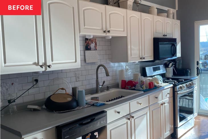 IKEA kitchen before renovation: white cabinets, wood floor, white tile backsplash, gray countertops