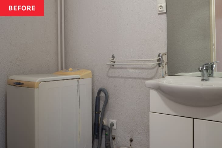 Before: Basic grayish white bathroom with washing machine in corner