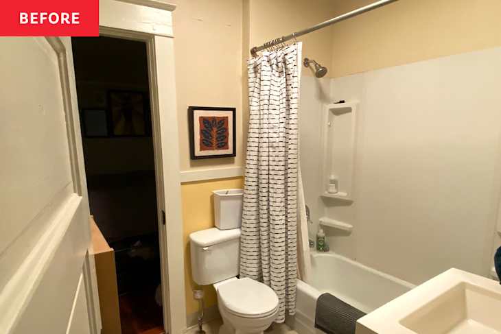 Small bathroom with a shower curtain, toilet, and sink, featuring yellow walls and framed artwork.