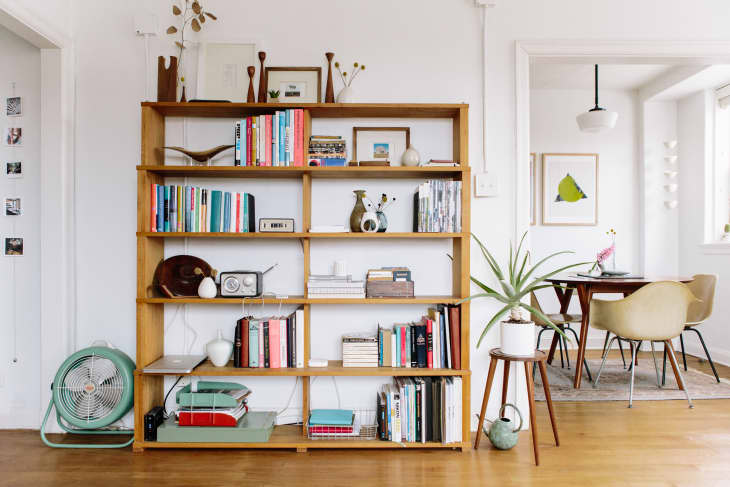 This Long Wall Of Shelving Incorporates Storage, A Fireplace