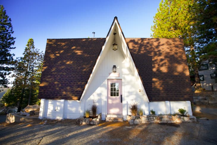 A-frame house with pink front door