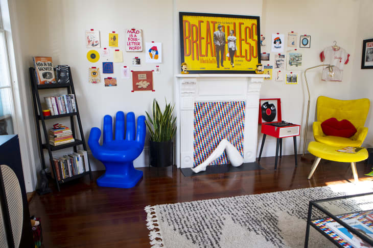 Colorful living room with blue hand-shaped chair