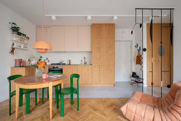 Coral colored small dining room and kitchen in apartment