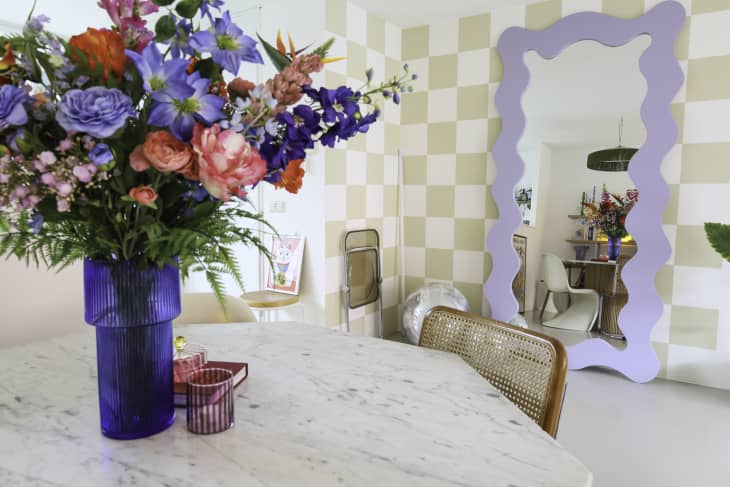 A stone dining table in a checker dining area.