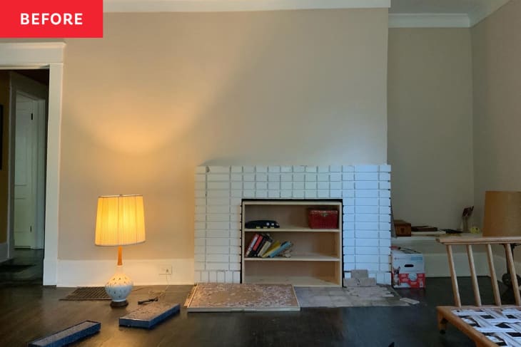 White brick fireplace in living room.