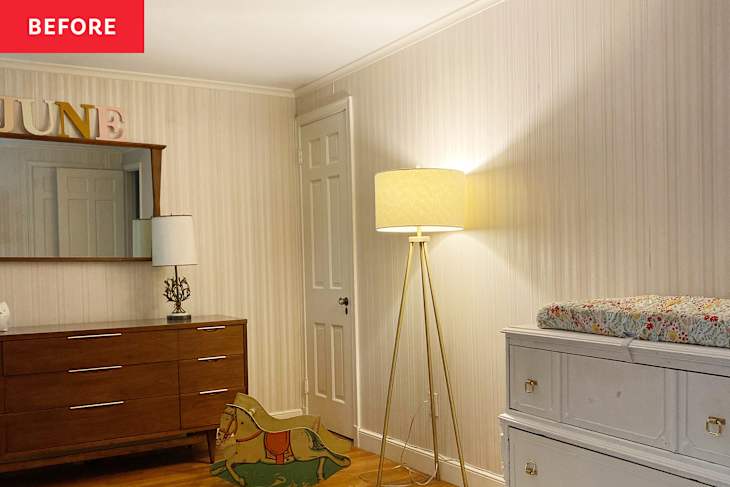 Nursery with wooden dresser, mirror, floor lamp, changing table, and toy rocking horse.