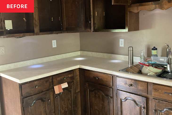 Wooden cabinets in kitchen before renovation.