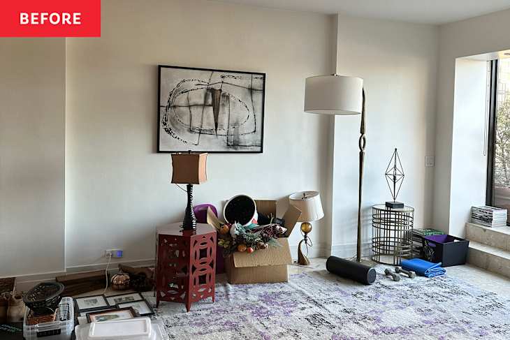 White walls in messy living room before renovation.