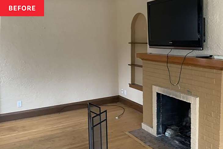 Living room with a mounted TV above a brick fireplace, wooden mantel, and a black fireplace screen.