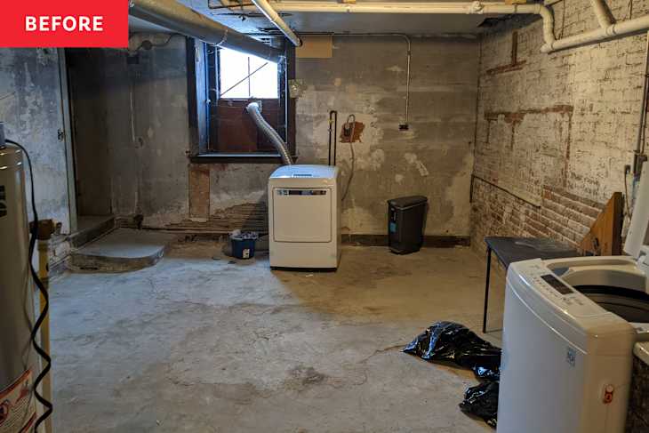 Washer and dryer in a basement with exposed brick walls, concrete floor, and a window.