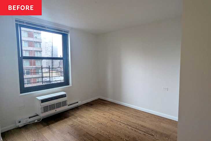 Empty room with hardwood flooring, a large window, and a wall-mounted air conditioning unit.