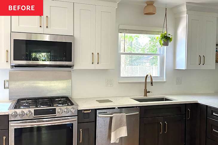Modern kitchen with white cabinets, stainless steel appliances, a gold faucet, and a hanging plant by the window.