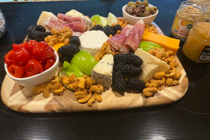 Charcuterie board on kitchen surface.