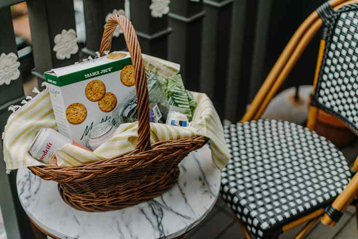 Snacks in basket on outdoor table.
