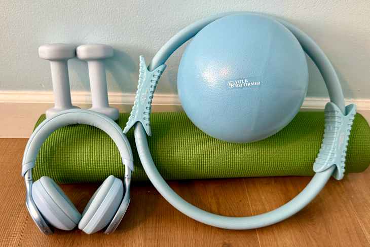 Your Reformer Prop Starter Kit with yoga mat on floor