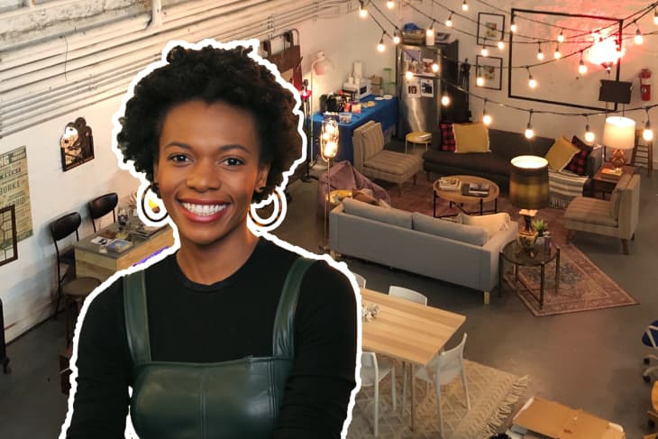 Smiling woman in a black top overlaid on a cozy living room with string lights, sofas, and a dining table.