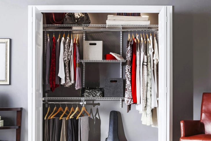 Rubbermaid HomeFree series 4-ft to 8-ft x 12-in White Wire Closet Kit in closet in gray room
