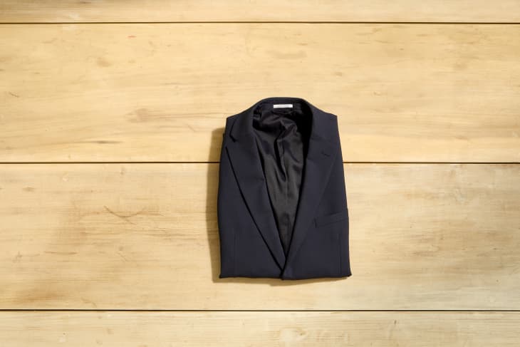 Overhead shot of a folded suit jacket.