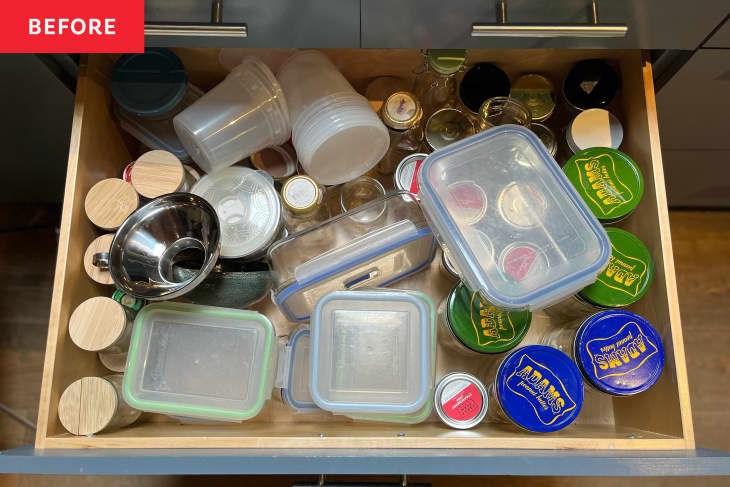 Messy kitchen tupperware drawer.