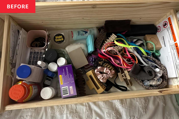 Messy drawer before organizing.