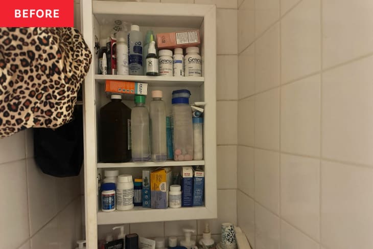 Bathroom medicine cabinet before being organized.