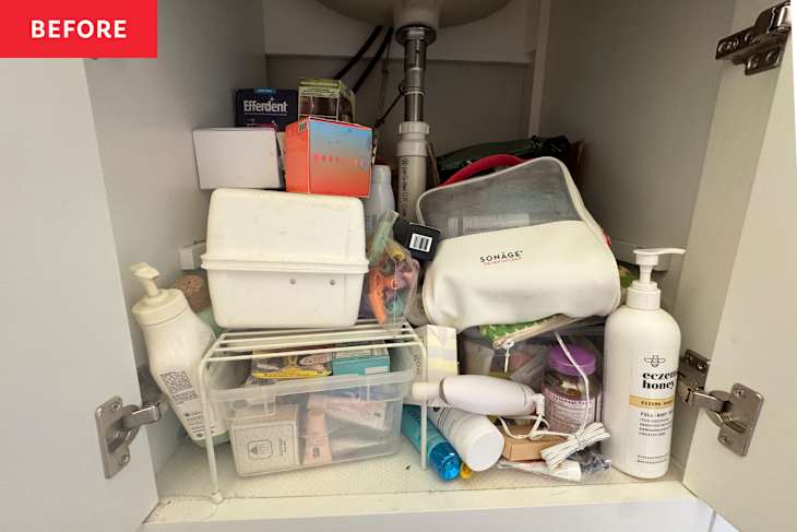Cluttered bathroom cabinet filled with various skincare products, containers, and a pump bottle.