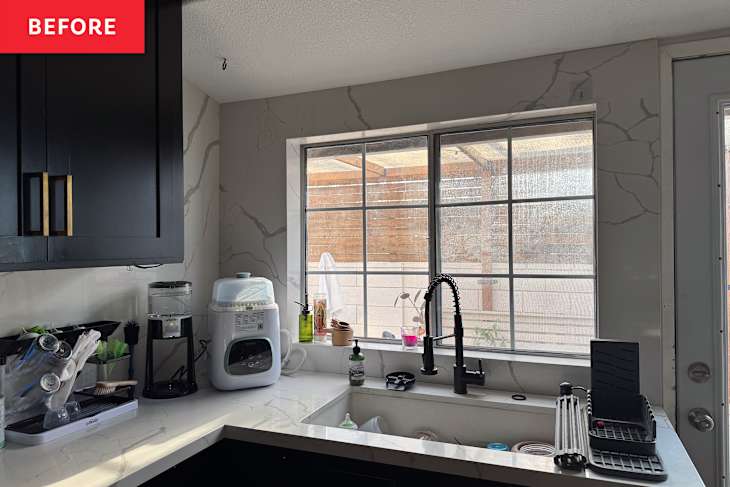 Kitchen corner with black cabinets.