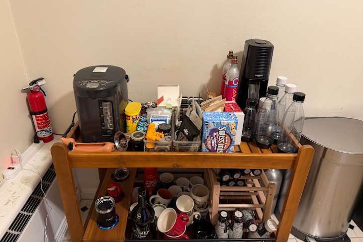 Messy kitchen coffee area.