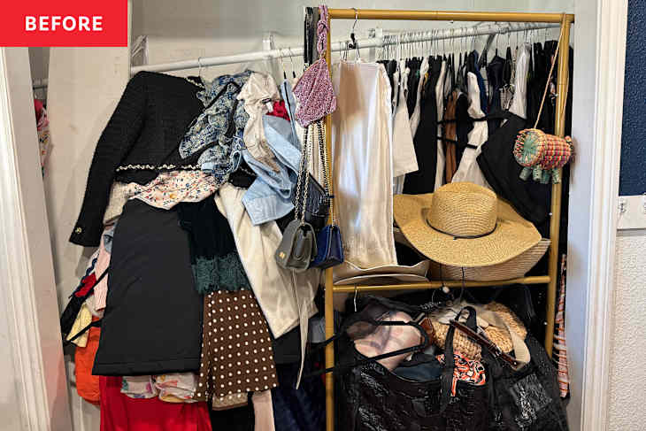 Clothing rack overflowing with various garments, hats, and bags in a cluttered closet space.