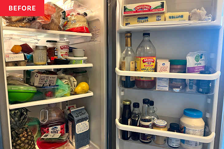 A cluttered refrigerator filled with various food items, condiments, and drinks, including fruits, jars, and containers.