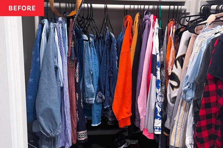 Clothes on hanger in closet before organization.