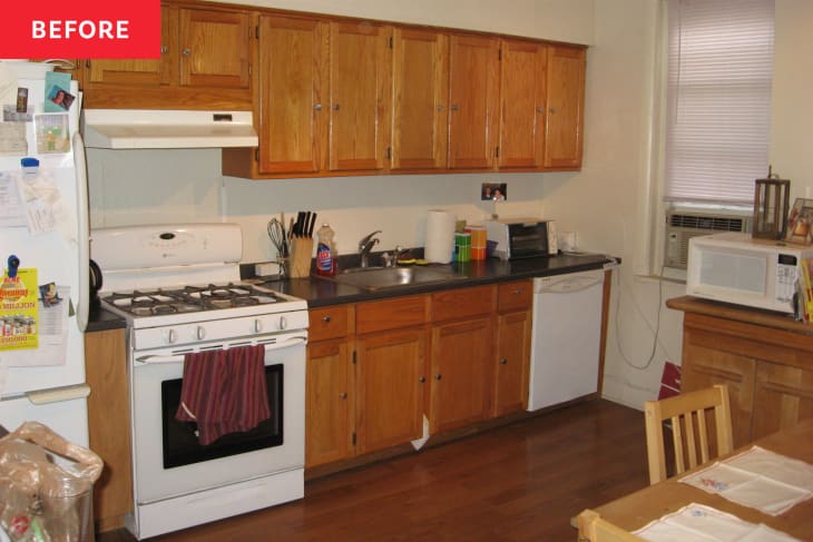 Philadelphia row house kitchen before staging: ambered wood cabinets, outdated furnishings/appliances