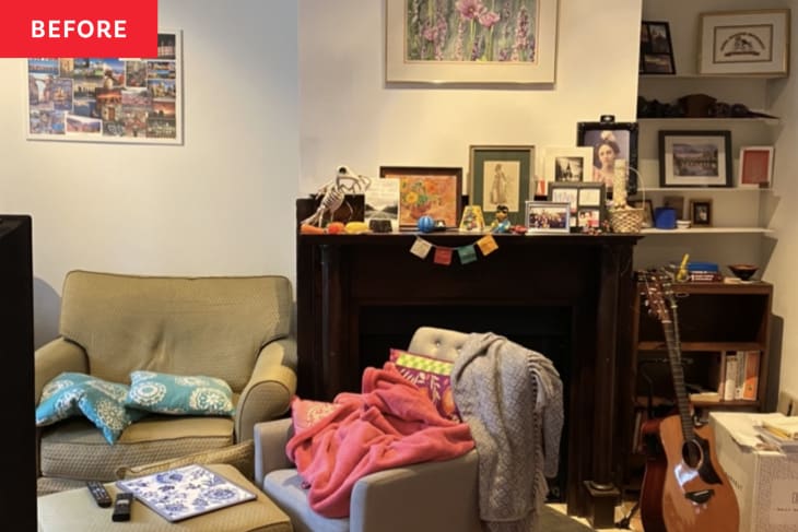 clutter, fireplace, track lighting, wood floors, guitar, picture frames, recess bookshelf, beige couch