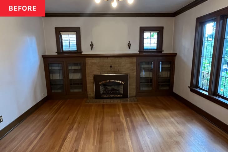 empty parlor with wood floor, white walls, and wood trim
