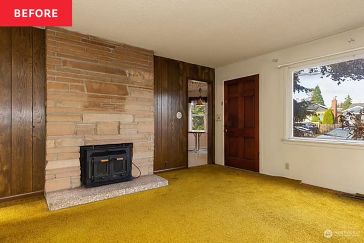 Mustard carpet in vintage wood paneled living room.