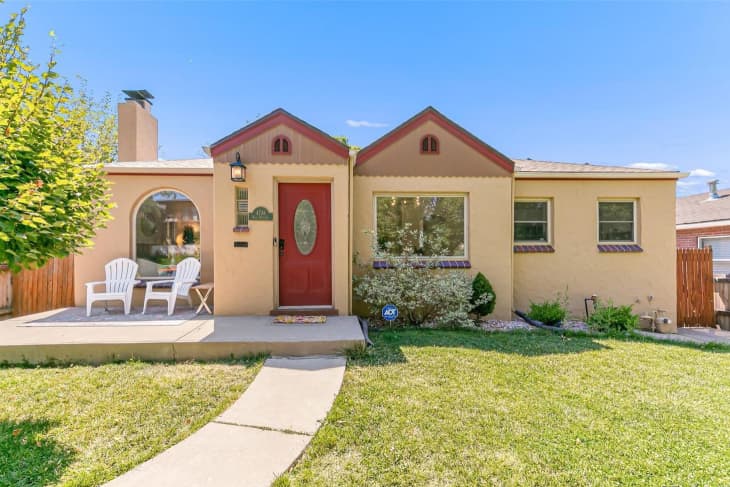 Exterior of bungalow home with lawn