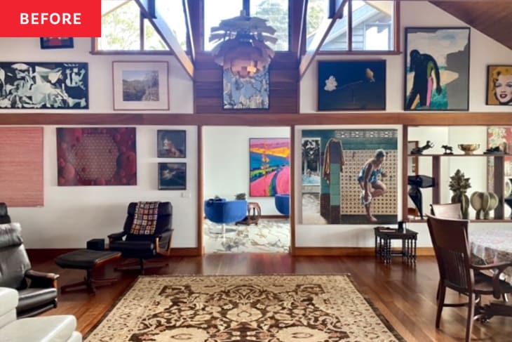 Living room with eclectic art collection, patterned rug, leather chairs, and wooden dining table.
