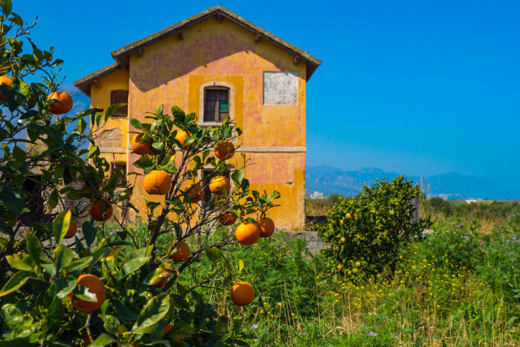 Classic country side farm home in Sicily at the base of the mountains at the edge of the sea