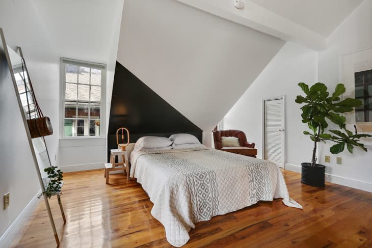 bedroom by Maureen Stevens design with a painted accent wall