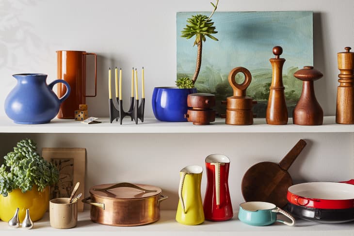 Colorful Dansk vintage pieces styled out on a shelf in a modern context